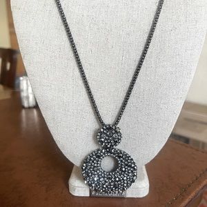Long dark metal necklace with crystal charm